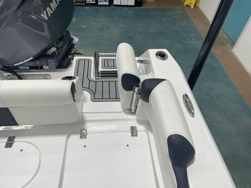 Slide: The Image of 2025 Tidewater 210 LXF boat interior with Yamaha engine, featuring white seating and deck details. - 31