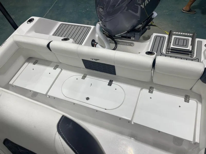 Slide: The Image of 2025 Tidewater 210 LXF boat interior with seating and storage compartments. - 32