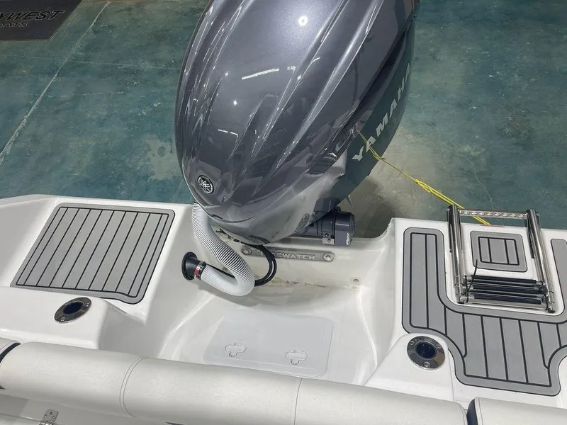Slide: The Image of 2025 Tidewater 210 LXF boat with outboard motor and swim platform. - 33