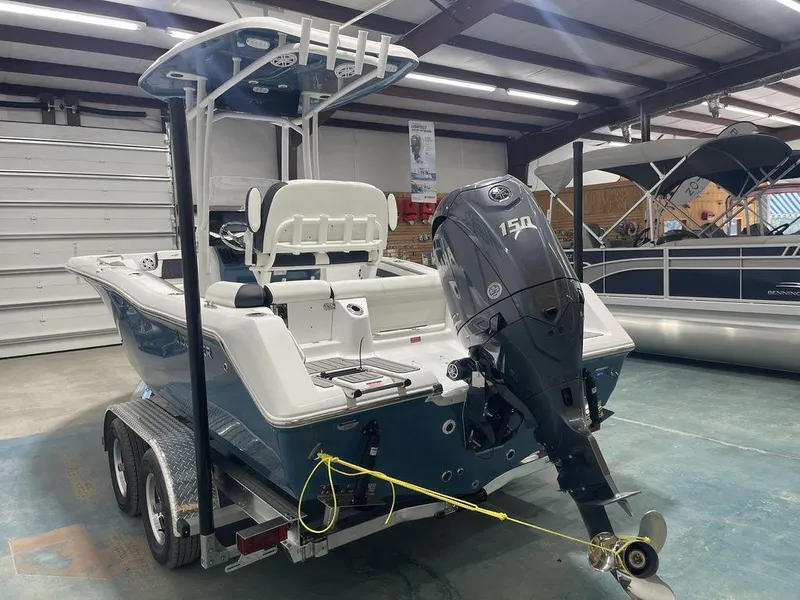 Slide: The Image of 2025 Tidewater 210 LXF boat with Yamaha 150 engine on trailer in showroom. - 36
