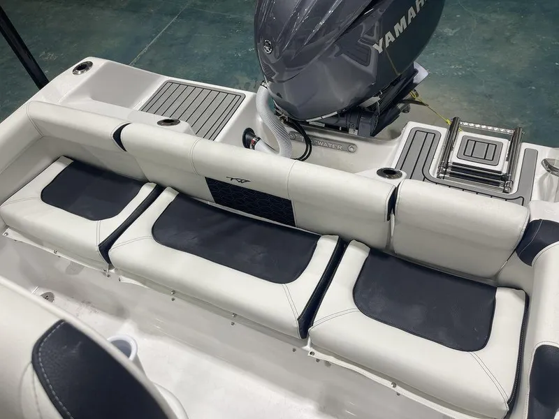 Slide: The Image of 2025 Tidewater 210 LXF boat interior with Yamaha engine, featuring sleek seating and modern design. - 8