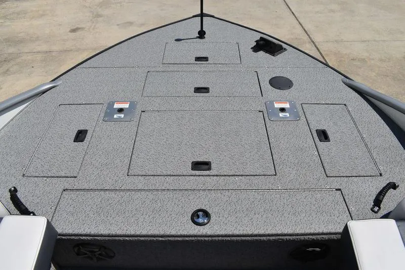 Slide: The Image of 2025 Lowe SD224 boat deck with storage compartments and fishing rod holder. - 14