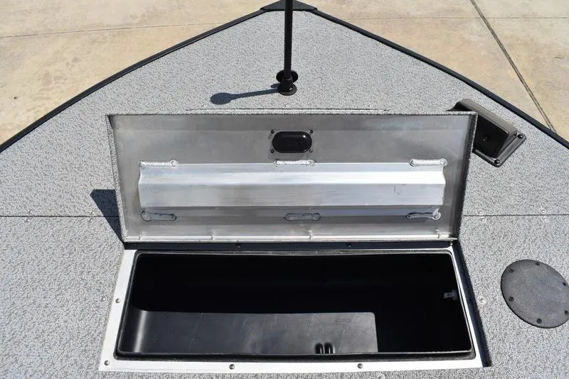 Slide: The Image of Open storage compartment on 2025 Lowe SD224 boat deck. - 15