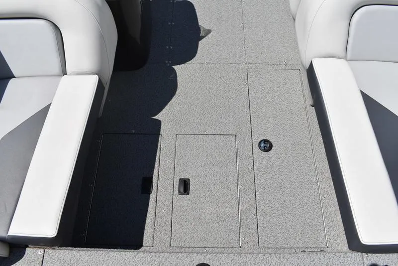 Slide: The Image of Interior view of 2025 Lowe SD224 boat with gray carpet and white seating. - 20