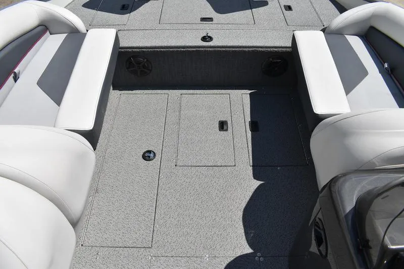 Slide: The Image of 2025 Lowe SD224 boat interior with gray carpet and white seating. - 21