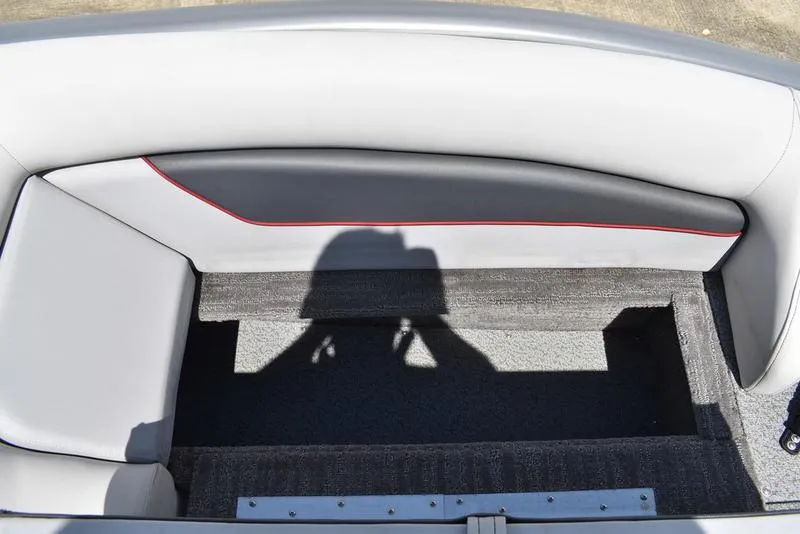 Slide: The Image of Interior of 2025 Lowe SD224 boat with storage compartment and cushioned seating. - 28