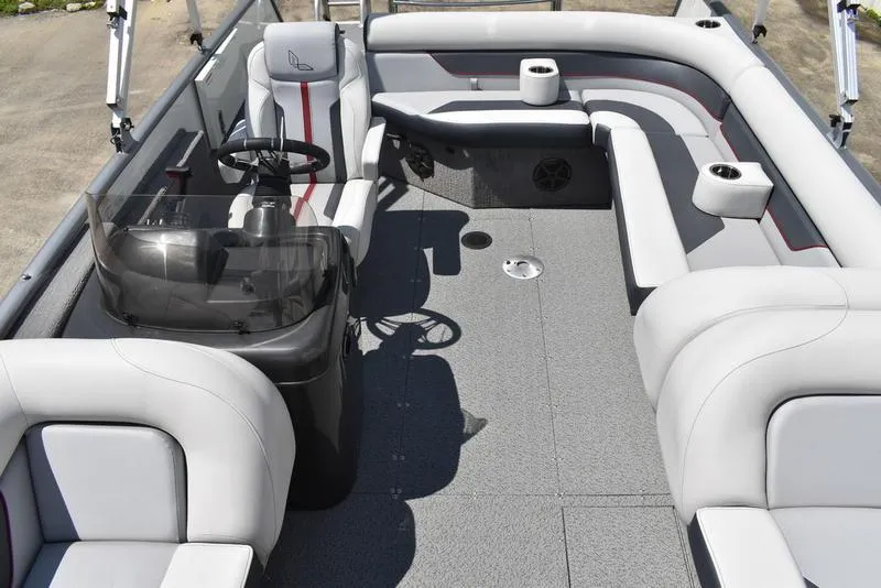 Slide: The Image of 2025 Lowe SD224 boat interior with gray seating and steering console. - 29