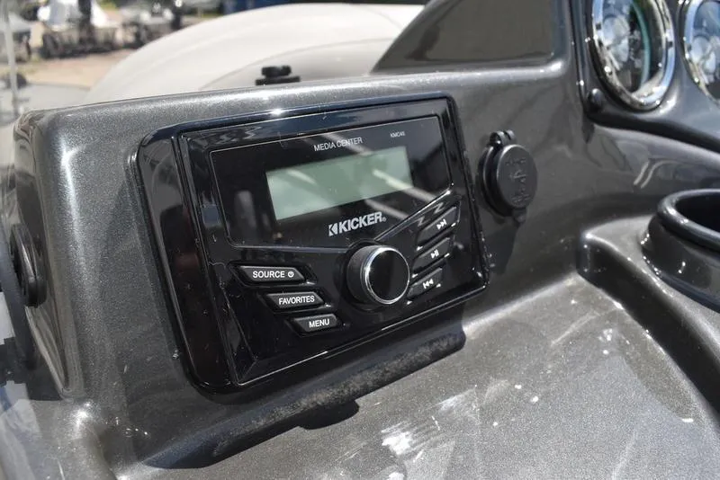 Slide: The Image of Dashboard of a 2025 Lowe SD224 boat featuring a Kicker media center. - 31