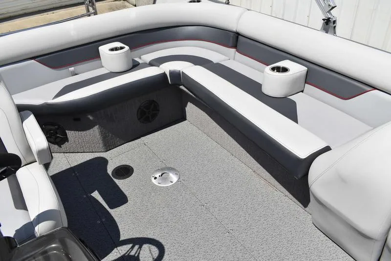Slide: The Image of Interior of 2025 Lowe SD224 boat with gray seating and cup holders. - 35