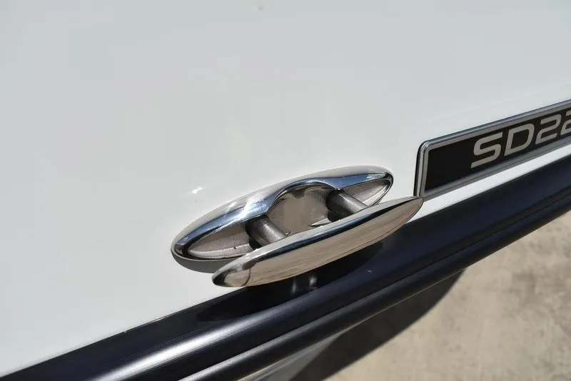 Slide: The Image of Close-up of 2025 Lowe SD224 boat cleat and model badge on white surface. - 42