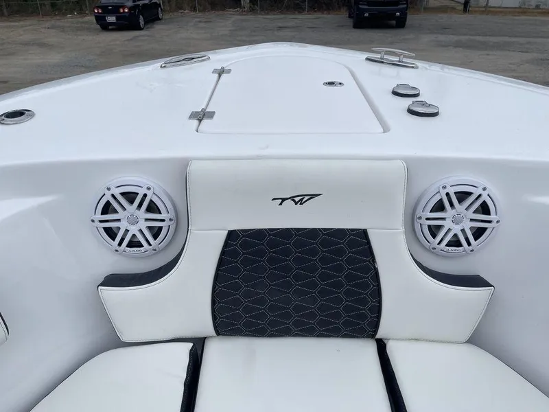 Slide: The Image of 2025 Tidewater 232cc boat interior with speakers and stylish seating. - 10