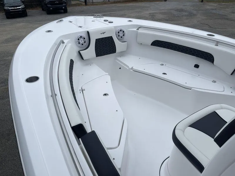 Slide: The Image of 2025 Tidewater 232cc boat interior with white seating and speakers. - 26
