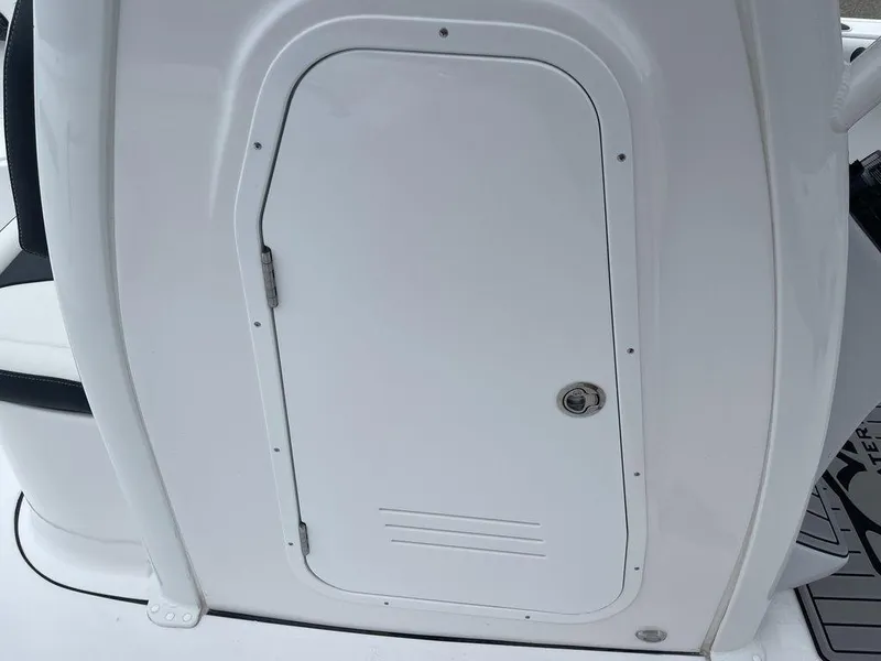 Slide: The Image of 2025 Tidewater 232cc boat storage compartment door, white finish. - 27