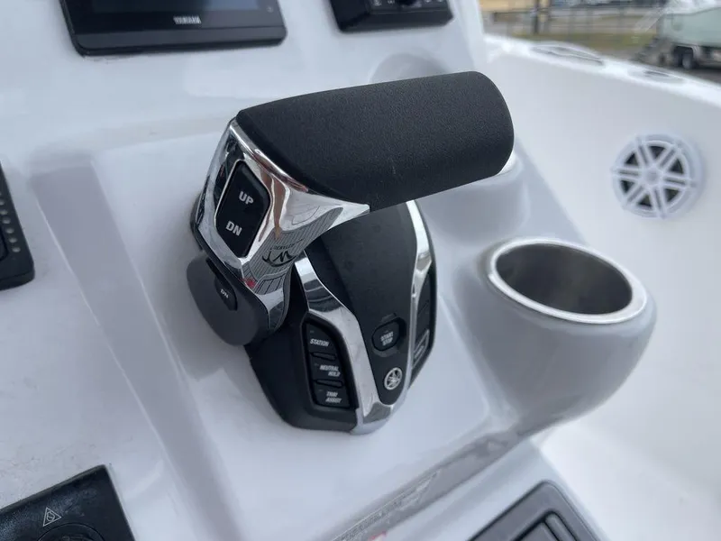 Slide: The Image of Close-up of 2025 Tidewater 232cc boat throttle control on dashboard. - 30