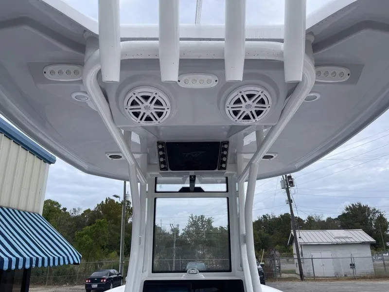 Slide: The Image of 2025 Tidewater 232cc boat with speakers and electronics on the T-top. - 37