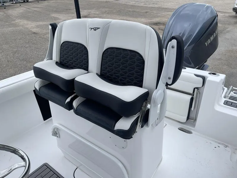Slide: The Image of 2025 Tidewater 232cc boat seats with Yamaha engine in background. - 40