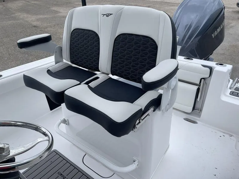 Slide: The Image of 2025 Tidewater 232cc boat with dual black and white cushioned seats. - 41