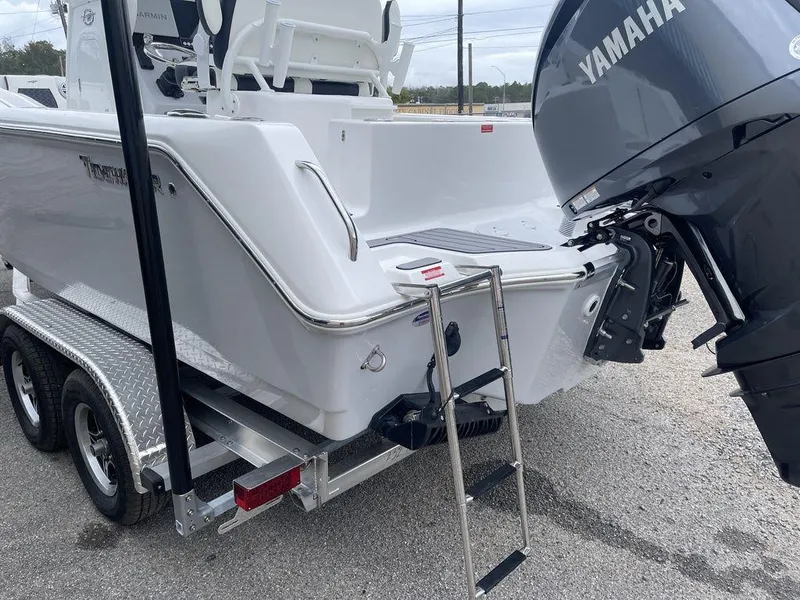 Slide: The Image of 2025 Tidewater 232cc boat with Yamaha motor on trailer, rear view. - 43