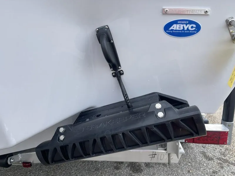 Slide: The Image of 2025 Tidewater 232cc boat with trim tab and ABYC certification sticker. - 45