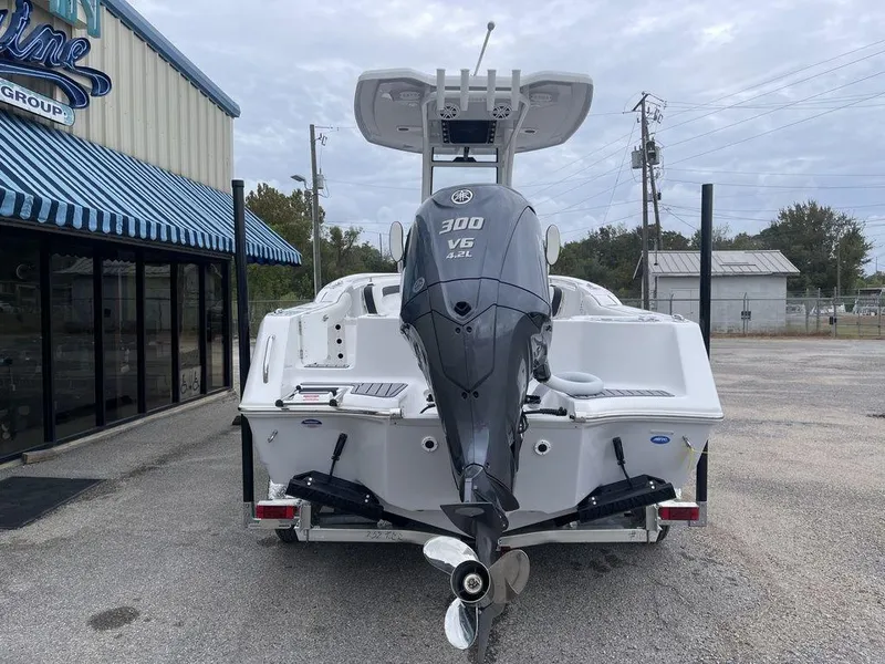 Slide: The Image of 2025 Tidewater 232cc boat with Yamaha 300 V6 engine, parked outside dealership. - 48