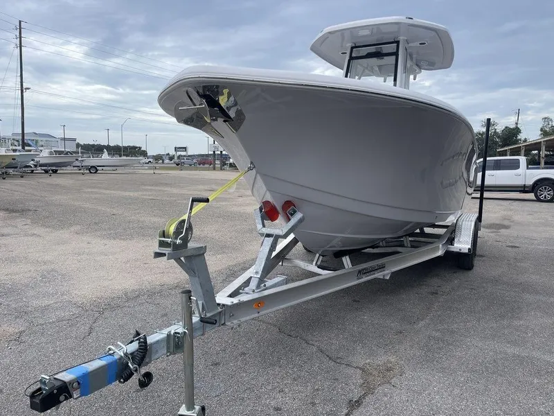 Slide: The Image of 2025 Tidewater 232cc boat on trailer in parking lot. - 49