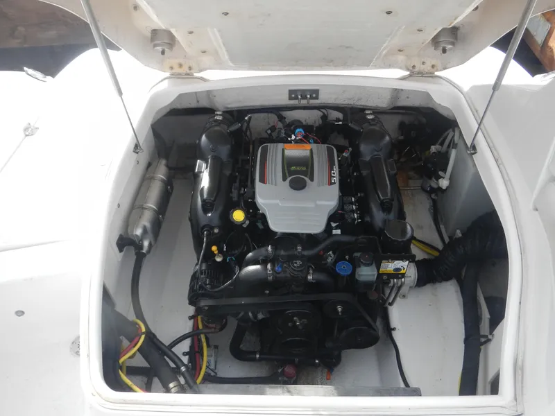 Slide: The Image of 2013 Chaparral 225 SSi boat engine compartment, showcasing a clean and organized layout. - 7