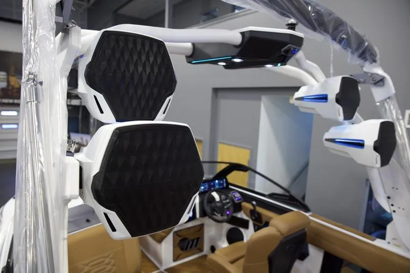 Slide: The Image of 2025 Malibu 26 LSV boat interior with advanced audio system and modern design. - 10