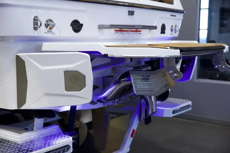 Slide: The Image of 2025 Malibu 26 LSV boat rear view with advanced exhaust system and swim platform. - 27