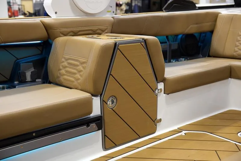Slide: The Image of Luxurious interior seating of 2025 Malibu 26 LSV boat with tan upholstery and sleek design. - 31