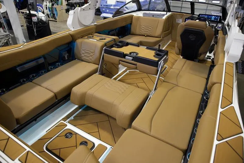 Slide: The Image of Luxurious interior of 2025 Malibu 26 LSV boat with tan leather seating. - 6