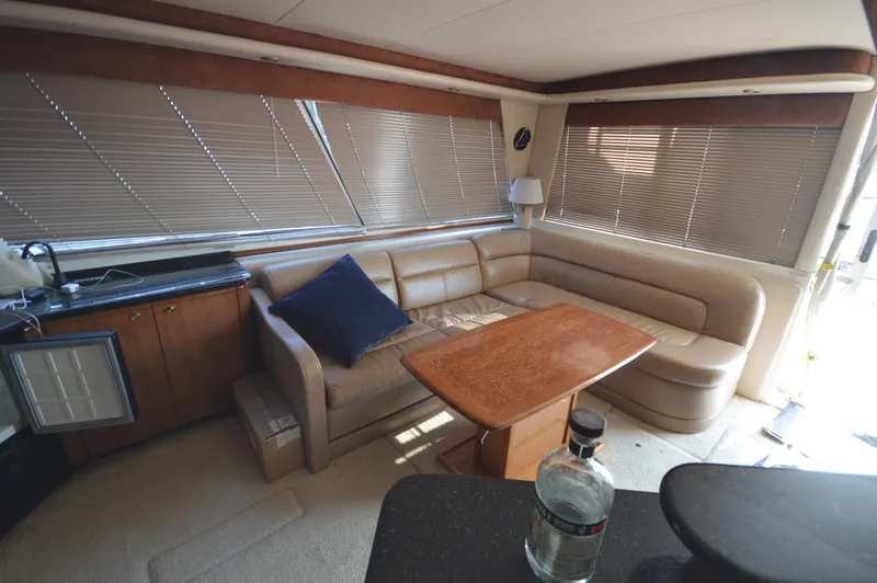 Slide: The Image of Interior of 2007 Meridian 490 Pilothouse yacht with leather seating and wooden table. - 22