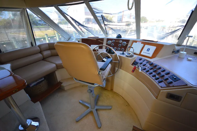 Slide: The Image of Pilothouse interior of 2007 Meridian 490, featuring steering wheel and control panels. - 25