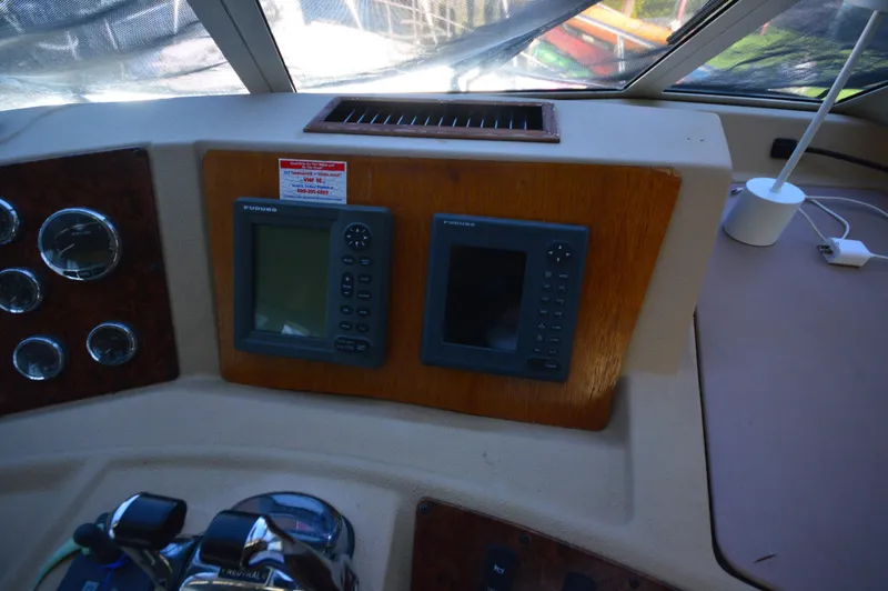 Slide: The Image of 2007 Meridian 490 Pilothouse dashboard with navigation instruments and controls. - 26