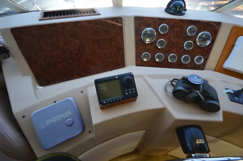 Slide: The Image of Dashboard of a 2007 Meridian 490 Pilothouse with navigation instruments and binoculars. - 27