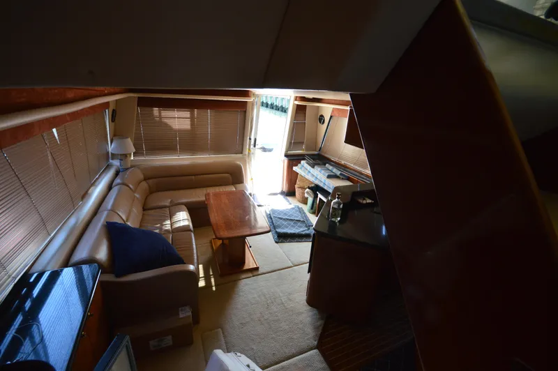 Slide: The Image of Interior of 2007 Meridian 490 Pilothouse yacht with cozy seating and wooden table. - 29