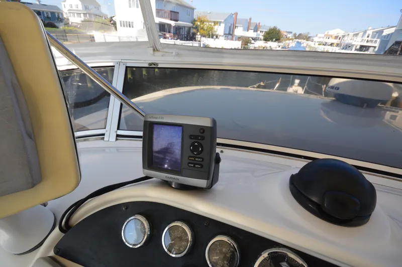 Slide: The Image of 2007 Meridian 490 Pilothouse dashboard with Garmin GPS, overlooking marina. - 33