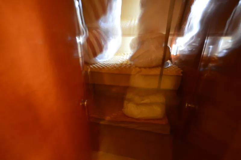 Slide: The Image of Blurred interior view of a 2007 Meridian 490 Pilothouse cabin with bedding. - 43