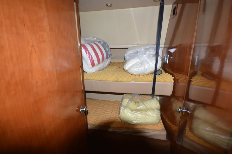 Slide: The Image of Interior of 2007 Meridian 490 Pilothouse with bunk beds and storage. - 45