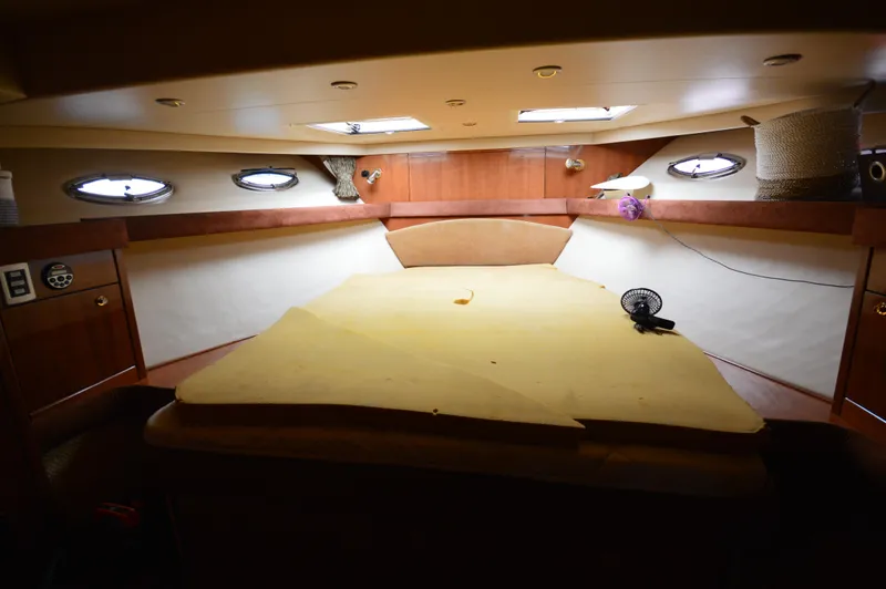 Slide: The Image of Interior cabin of 2007 Meridian 490 Pilothouse yacht with bed and portholes. - 46