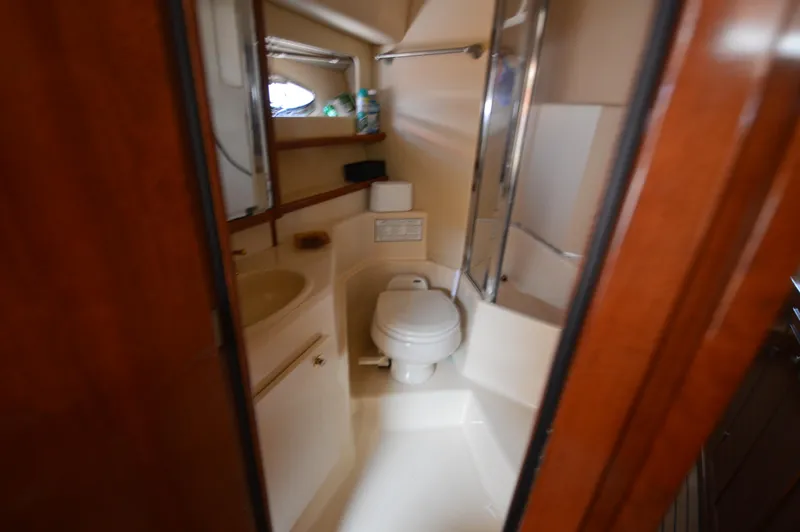 Slide: The Image of Bathroom interior of 2007 Meridian 490 Pilothouse yacht, featuring toilet and sink. - 48