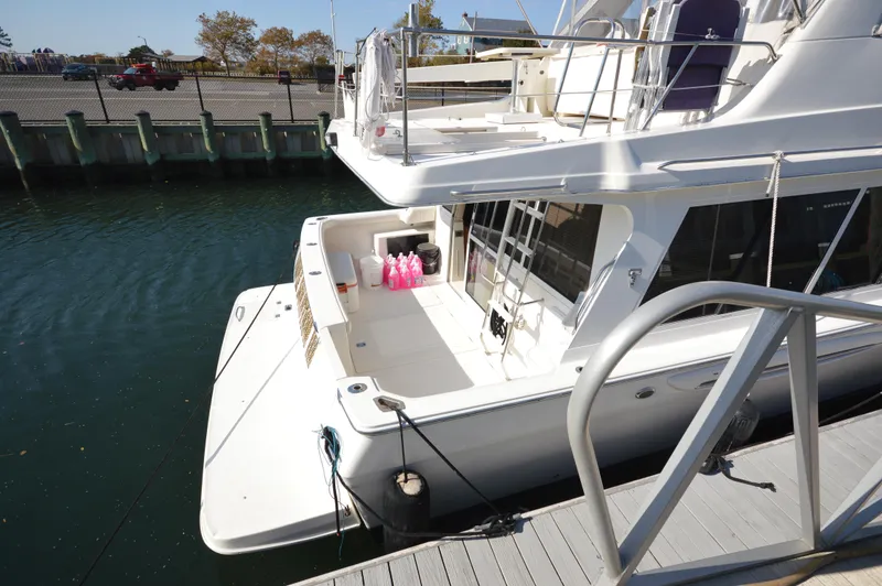 Slide: The Image of 2007 Meridian 490 Pilothouse yacht docked at marina, rear view. - 6