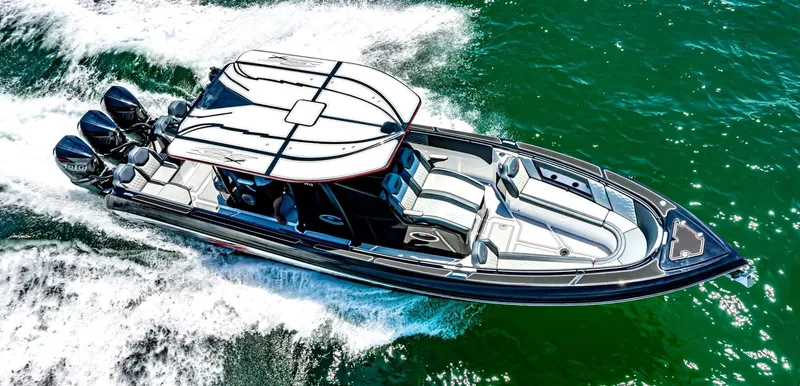 Slide: The Image of 2025 Glasstream GSX 360 LS boat cruising on open water. - 1
