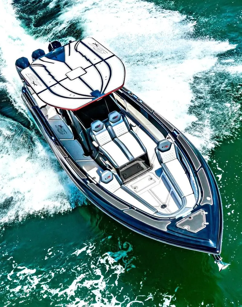 Slide: The Image of 2025 Glasstream GSX 360 LS speedboat cruising on vibrant blue water. - 10