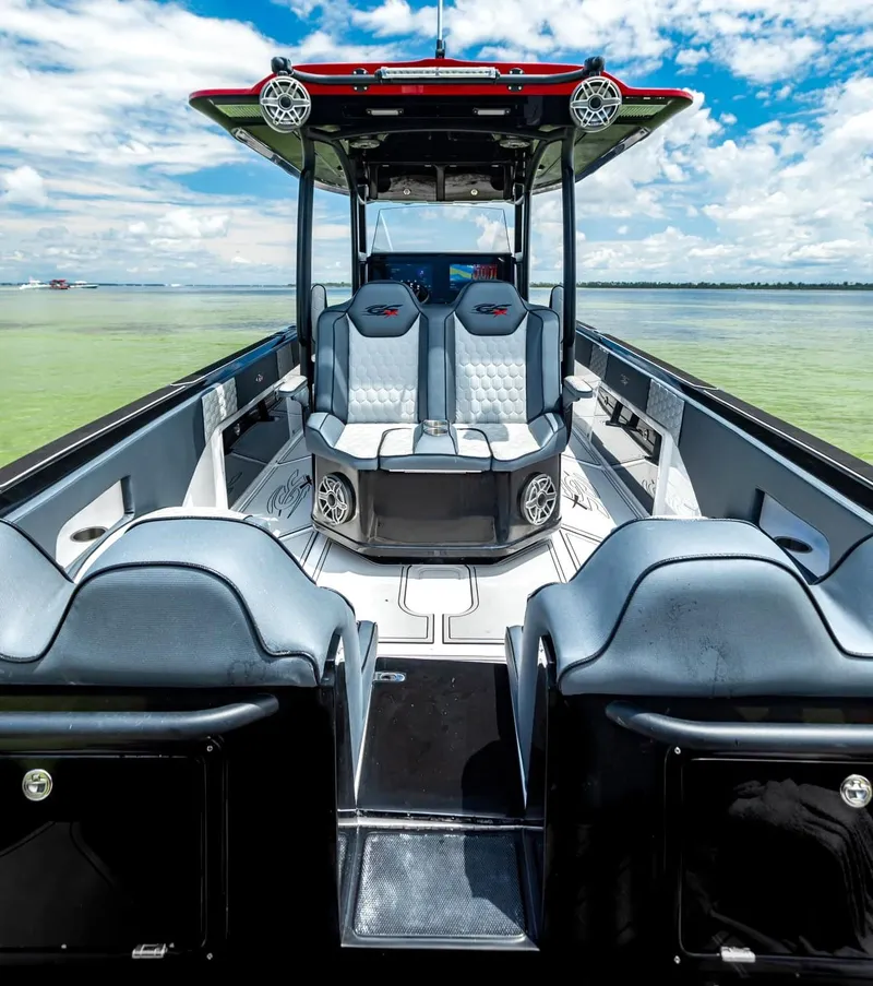 Slide: The Image of 2025 Glasstream GSX 360 LS boat interior with sleek seating and modern design on open water. - 12