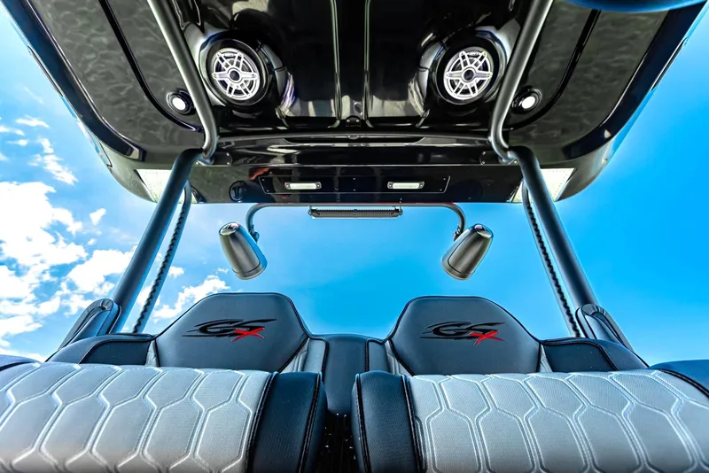 Slide: The Image of 2025 Glasstream GSX 360 LS boat interior with sleek seats and overhead speakers. - 13