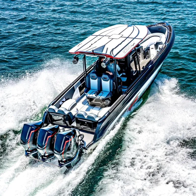 Slide: The Image of 2025 Glasstream GSX 360 LS speedboat cruising on open water. - 15