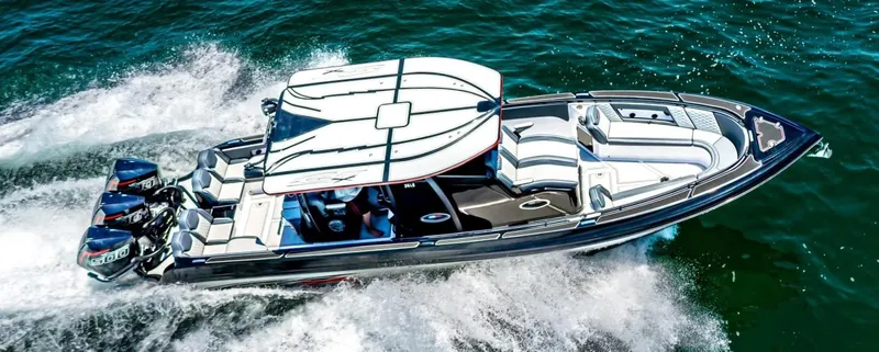Slide: The Image of 2025 Glasstream GSX 360 LS speedboat cruising on open water. - 2