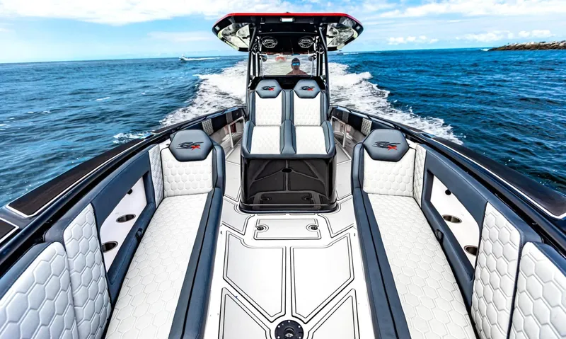 Slide: The Image of 2025 Glasstream GSX 360 LS boat cruising on open water, featuring luxurious seating and sleek design. - 3