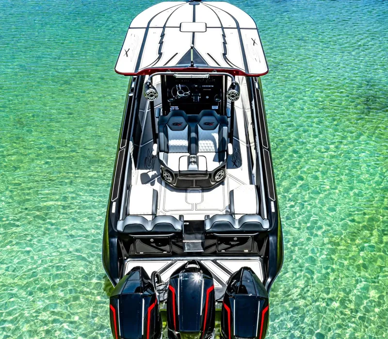 Slide: The Image of 2025 Glasstream GSX 360 LS boat on clear turquoise water, aerial view. - 5