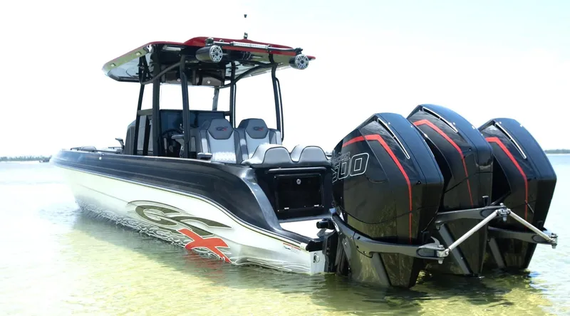 Slide: The Image of 2025 Glasstream GSX 360 LS boat with triple outboard engines in shallow water. - 7